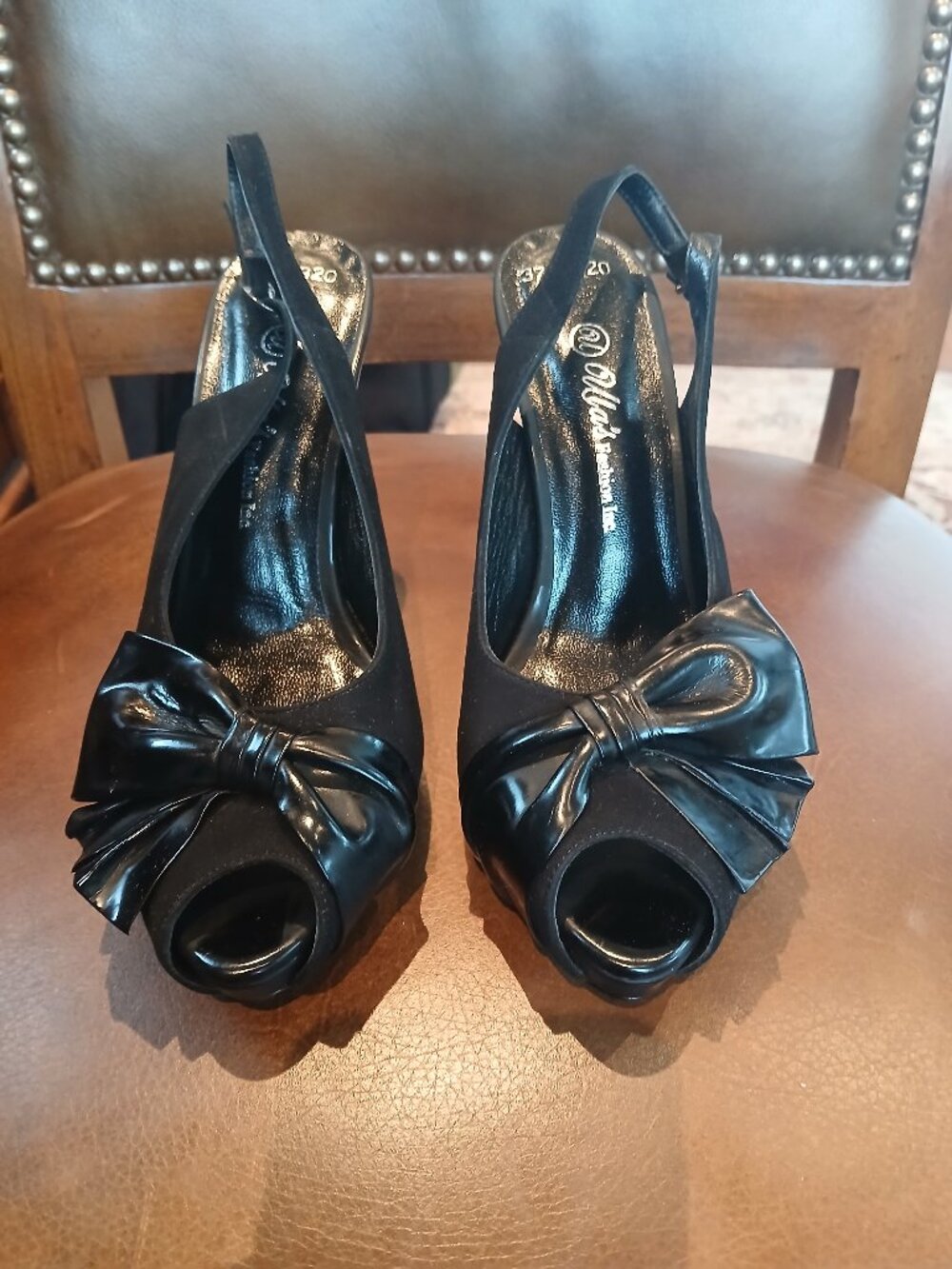 All black leather heels with a twist.